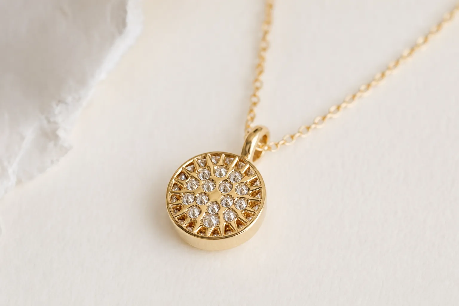 Pendant with inverted-set diamonds, pointed culets facing outward like tiny spikes, yellow gold